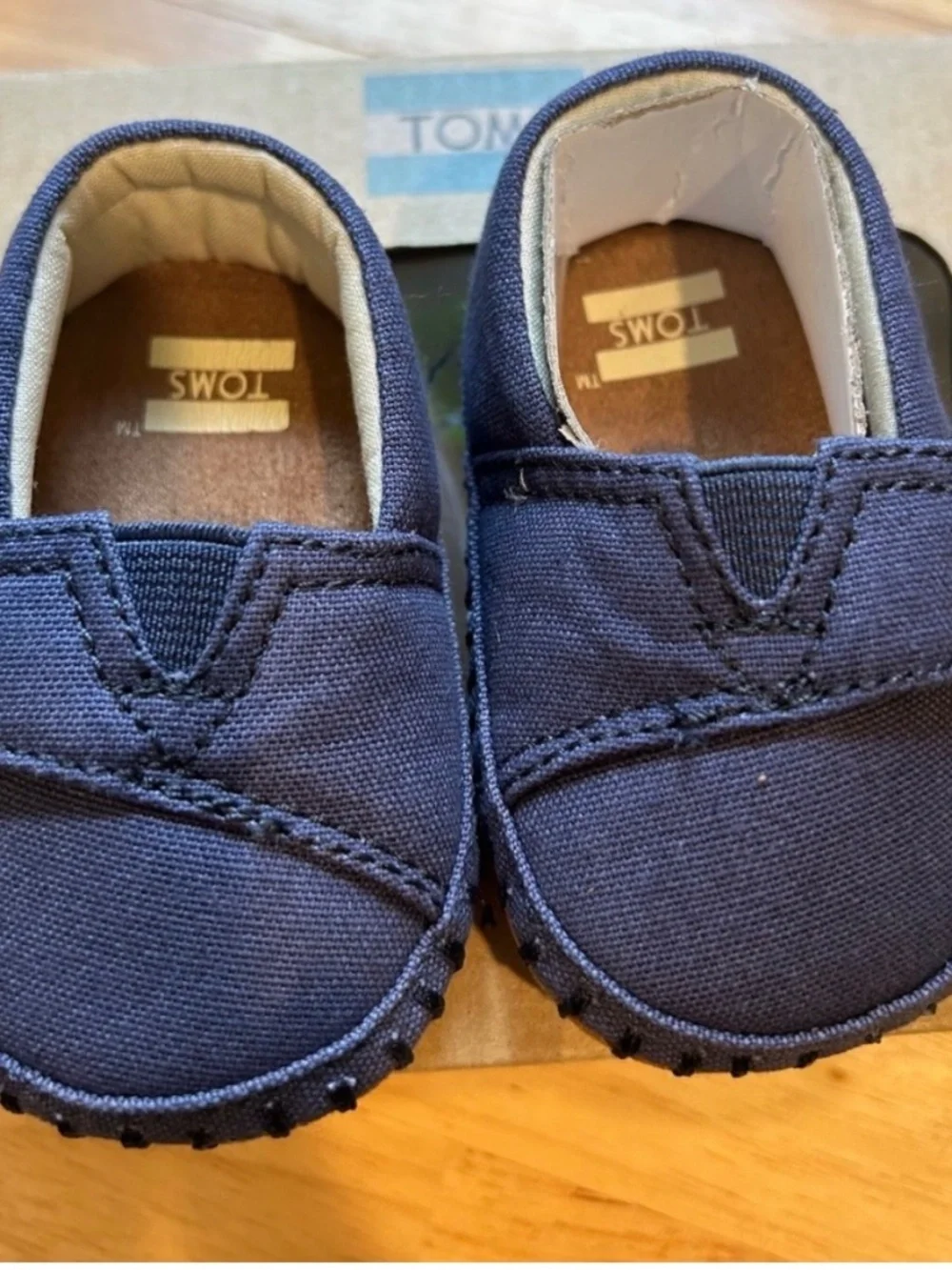 Navy Toms infant size 1 shoes.